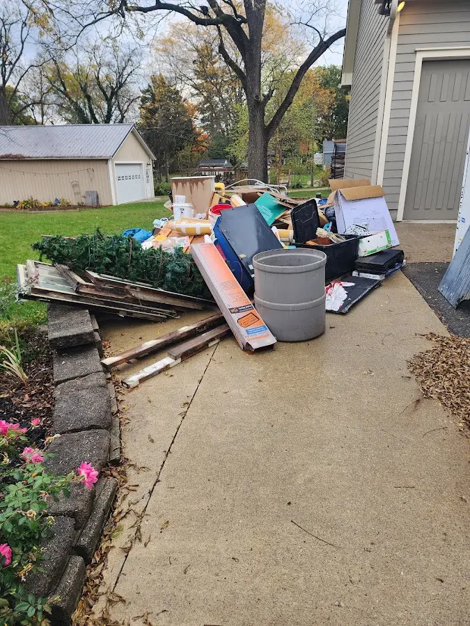 Dumpster being loaded with debris for 3 Yard Dumpster Rental in Queen Creek